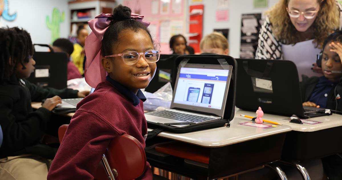 Teacher helping student