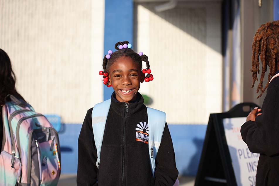 students and teacher working in classroom