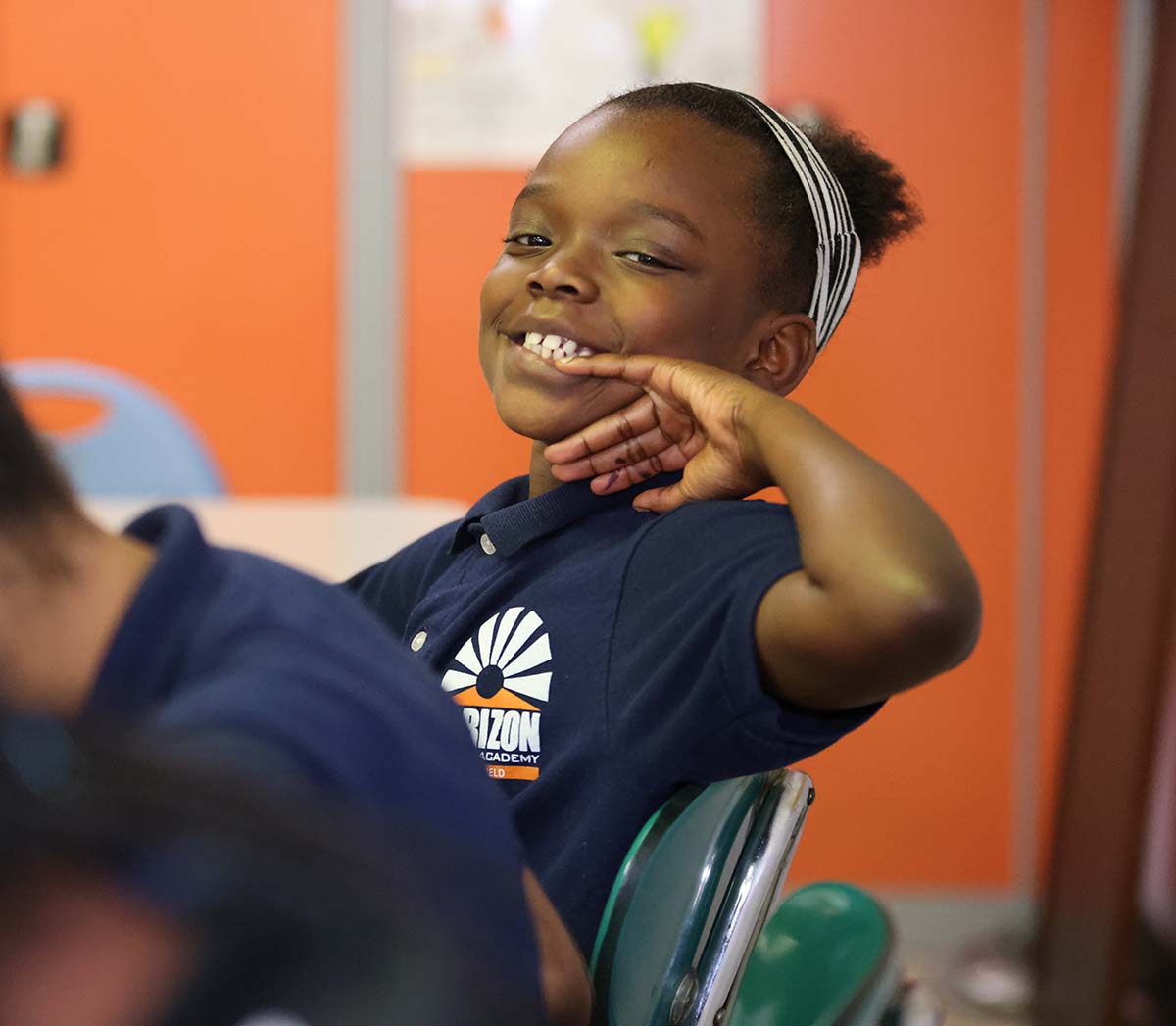 Horizon Science Academy Springfield student drawing at a desk in a classroom setting